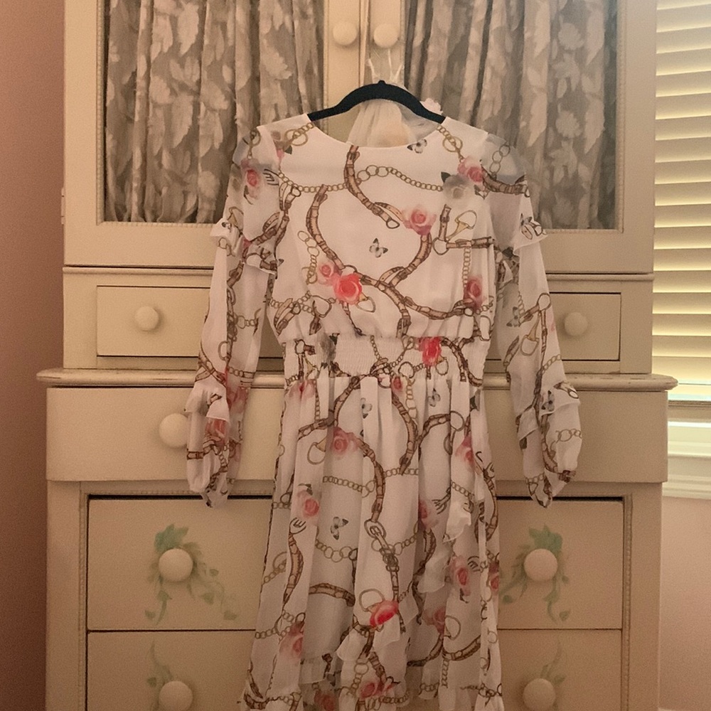 Beautiful dress with ruffles .. dressy . Feminine